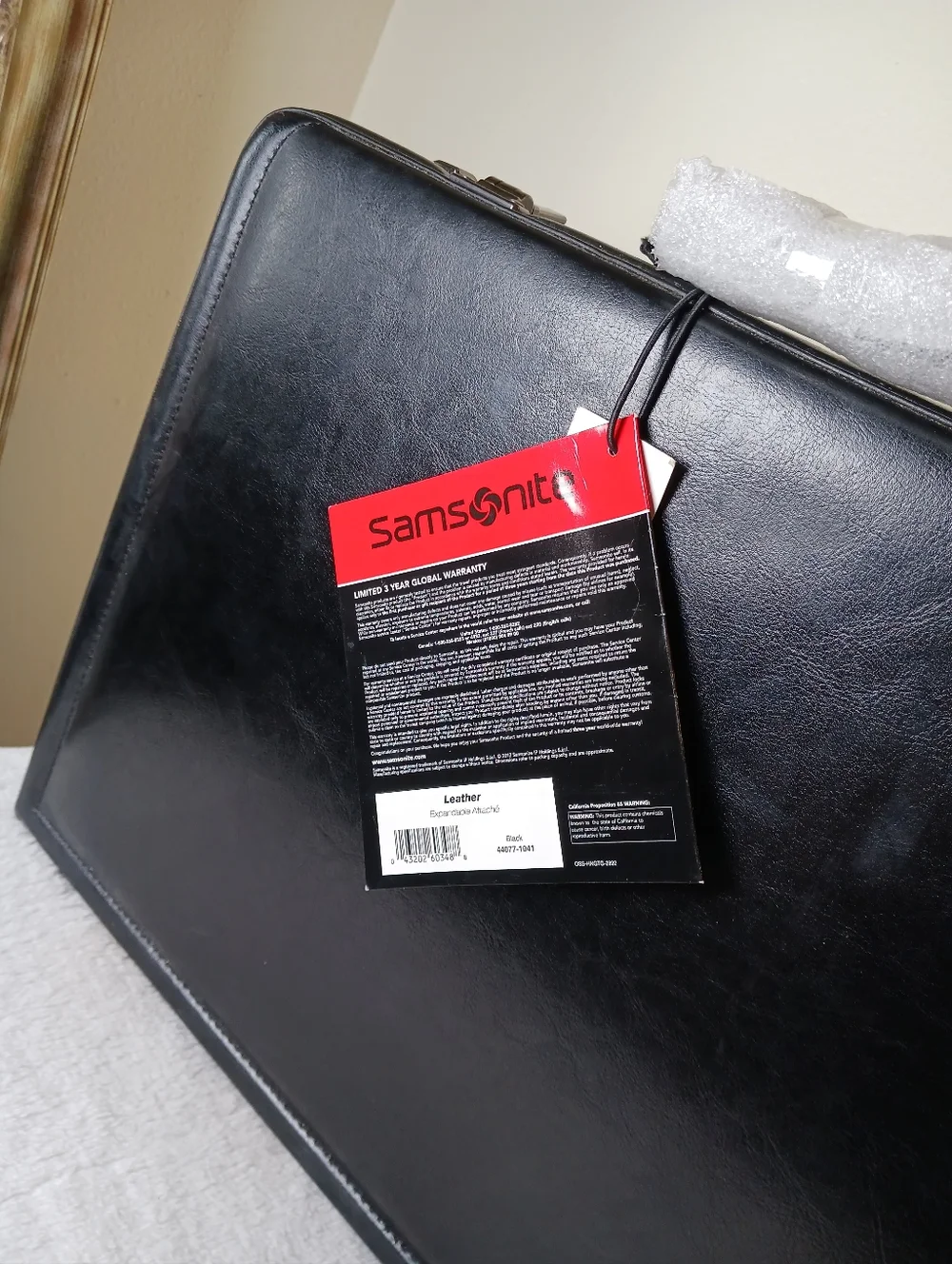 Samsonite Black Leather Briefcase with Red Tag